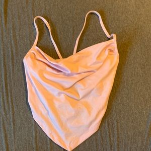 Droopy front with tie in the back mostly an open back